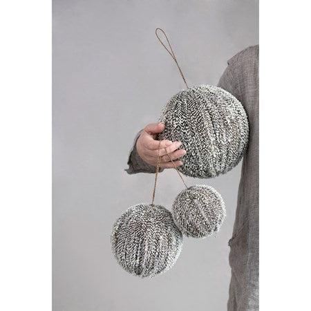 ROUND TEXTURED BALL ORNAMENT WITH SNOW